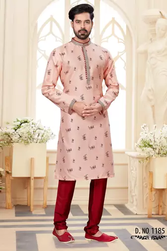 A soft peach kurta with scattered red floral motifs and striped detailing along the collar, placket, and cuffs