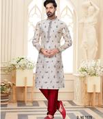 Off white printed kurta with scattered red floral motifs and striped detailing on the collar, placket, and cuffs,