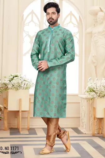 A teal blue printed kurta with repeating floral medallions in muted gold and rust, finished