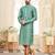 A teal blue printed kurta with repeating floral medallions in muted gold and rust, finished