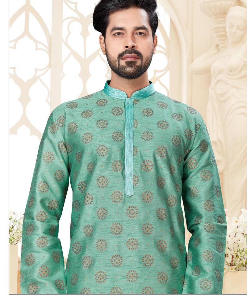 A teal blue printed kurta with repeating floral medallions in muted gold and rust, finished