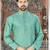 A sea-green printed kurta with a subtle gold diamond pattern, finished with a matching band collar and button placket