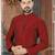 A rich maroon printed kurta with a subtle geometric pattern and fine gold detailing along the collar, placket, and cuffs