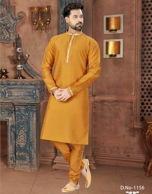 Mustard kurta with a clean silhouette and contrasting floral detailing along the collar, placket and cuffs 1