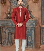 Deep red kurta with a subtle sheen and contrasting floral trim on the collar, placket and cuffs