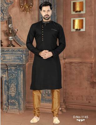 Black kurta with a subtle textured finish, featuring an asymmetrical line of gold-tone buttons. 1