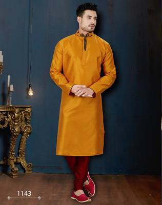Mustard kurta with a subtle textured finish, accented by a dark embroidered band collar and placket. 1