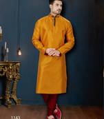 Mustard kurta with a subtle textured finish, accented by a dark embroidered band collar and placket.