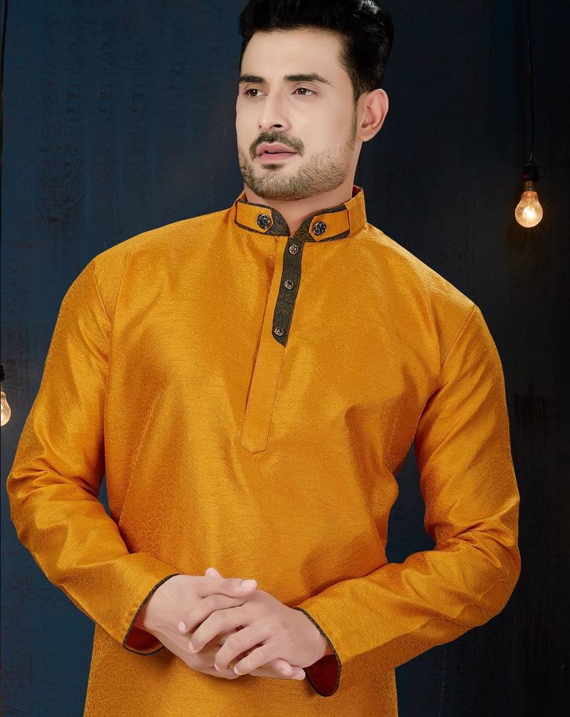 Mustard kurta with a subtle textured finish, accented by a dark embroidered band collar and placket.