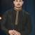 Charcoal-black kurta with a subtle geometric pattern and gold-trimmed collar, placket and cuffs