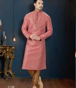 Dusty-rose kurta with a subtle textured finish and ornate contrasting trim along the collar and placket