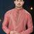 Dusty-rose kurta with a subtle textured finish and ornate contrasting trim along the collar and placket