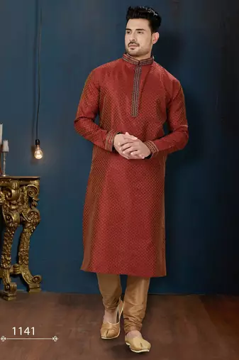 Rust-red kurta with a subtle all-over pattern and ornate gold-toned trim along the collar, placket and cuffs