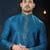 Teal-blue kurta with a subtle jacquard pattern and fine gold piping on the collar, placket and cuffs