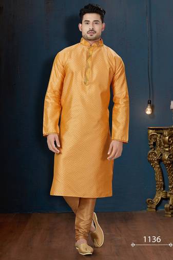 Mustard-gold kurta with a subtle tonal pattern and a contrasting gold placket, styled with matching trousers.