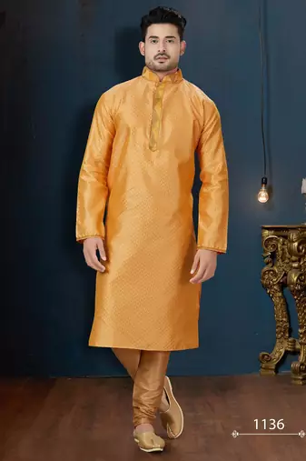 Mustard-gold kurta with a subtle tonal pattern and a contrasting gold placket, styled with matching trousers.