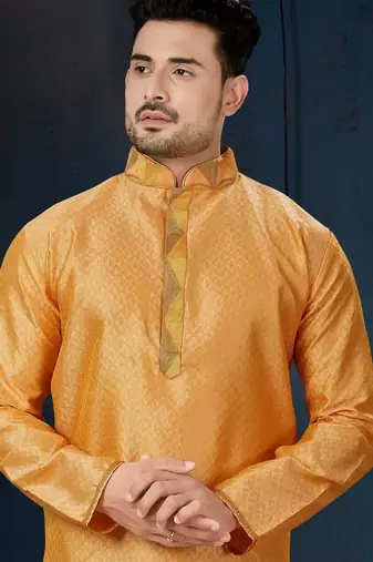 Mustard-gold kurta with a subtle tonal pattern and a contrasting gold placket, styled with matching trousers.