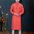 Coral-pink kurta with a subtle along the collar,placket and cuffs,paired with white trousers.