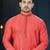 Coral-pink kurta with a subtle along the collar,placket and cuffs,paired with white trousers.
