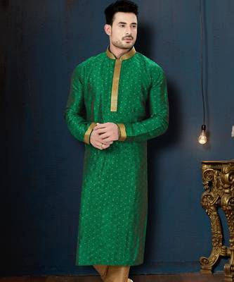 Emerald-green kurta with subtle gold motifs, finished with a gold-trimmed band collar with gold trousers. 1