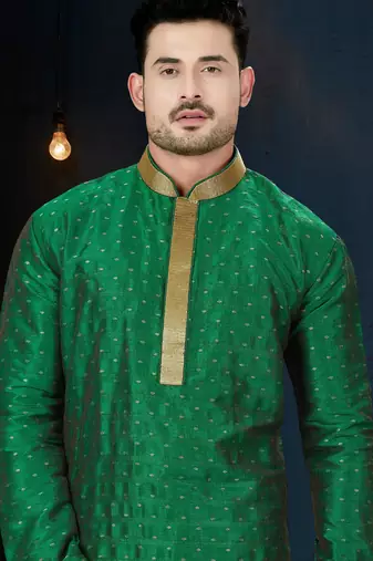 Emerald-green kurta with subtle gold motifs, finished with a gold-trimmed band collar with gold trousers.
