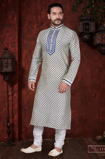 Cream kurta with an all-over blue motif, finished with a bold embroidered placket and matching cuff accents; styled