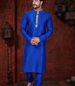 Royal-blue kurta with cream-and-blue floral detailing on the band collar and placket, paired