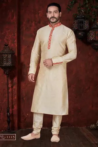 Fawn kurta set with elegant coral-red patterned trim on the collar, placket, and cuffs—simple festive wear