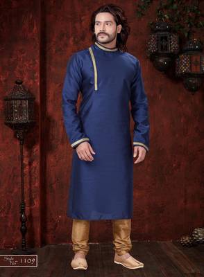 Blue kurta with elegant gold trim, paired with gold trousers—simple, refined festive style. 1
