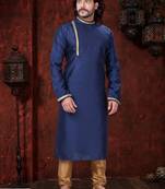 Blue kurta with elegant gold trim, paired with gold trousers—simple, refined festive style.