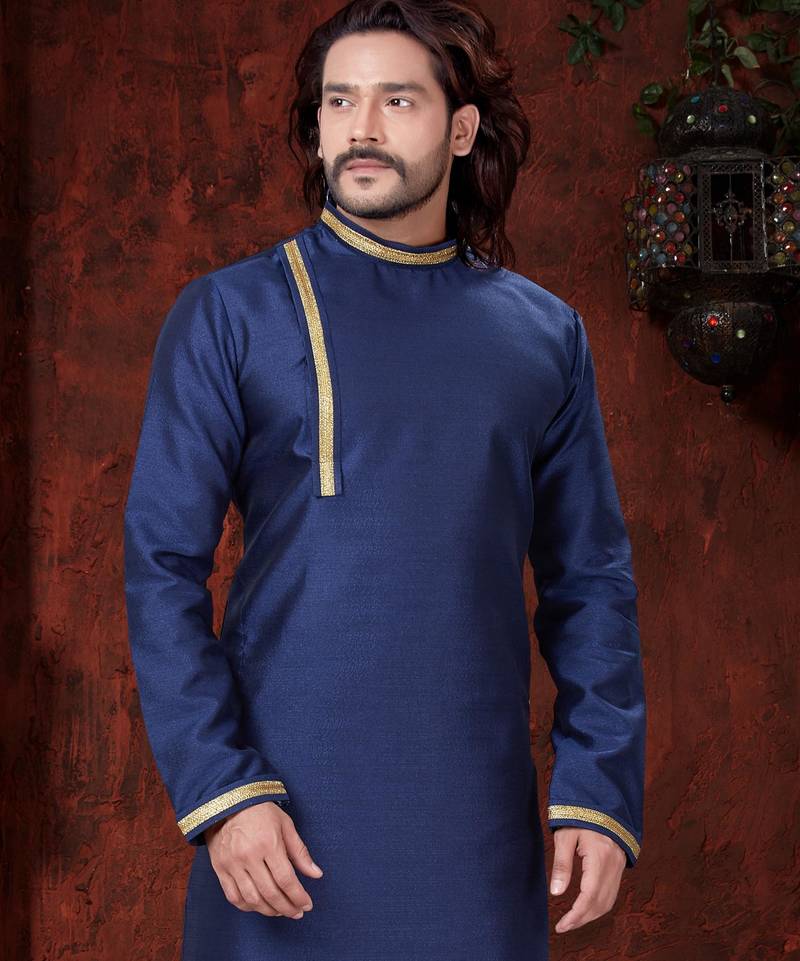Blue kurta with elegant gold trim, paired with gold trousers—simple, refined festive style.