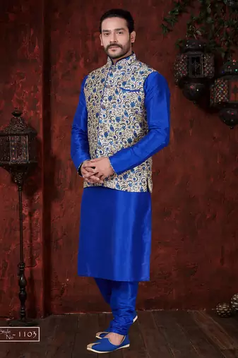 Royal-blue kurta set with a cream floral nehru jacket featuring blue detailing—an elegant festive look.