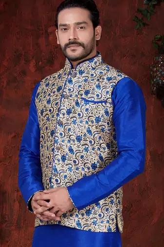 Royal-blue kurta set with a cream floral nehru jacket featuring blue detailing—an elegant festive look.
