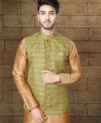 Olive-green textured nehru jacket with a matching pocket square, paired with a copper-gold kurta and trousers. 2