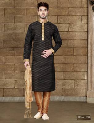 Black kurta with subtle gold motifs and gold-trimmed detailing, paired with brown trousers --an elegant festive wear 1