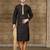 Black kurta with subtle gold motifs and gold-trimmed detailing, paired with brown trousers --an elegant festive wear