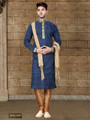 Navy patterned kurta with gold trim paired with brown trousers—an elegant festive ensemble. 1
