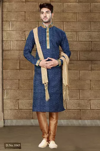 Navy patterned kurta with gold trim paired with brown trousers—an elegant festive ensemble.