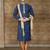 Navy patterned kurta with gold trim paired with brown trousers—an elegant festive ensemble.