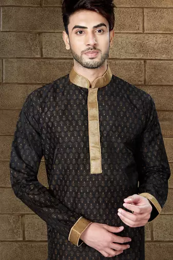 Black kurta with subtle gold motifs and gold-trimmed detailing, paired with brown trousers --an elegant festive wear