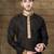 Black kurta with subtle gold motifs and gold-trimmed detailing, paired with brown trousers --an elegant festive wear