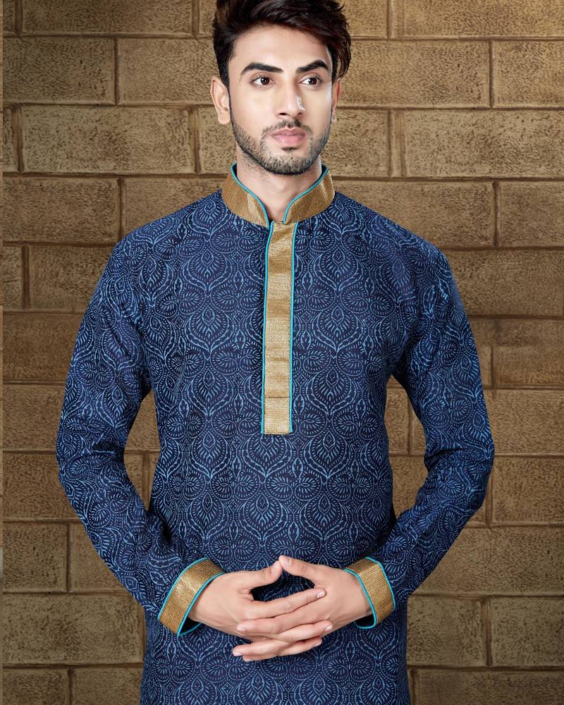 Navy patterned kurta with gold trim paired with brown trousers—an elegant festive ensemble.