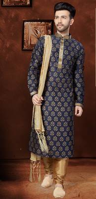 Navy kurta with rich gold motifs and trim, paired with gold trousers —perfect for festive celebrations. 1
