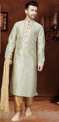 Off white printed kurta with gold-trimmed detailing, paired with gold trousers—an elegant festive look. 1