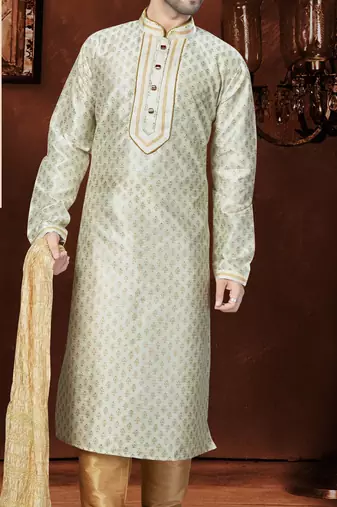 Off white printed kurta with gold-trimmed detailing, paired with gold trousers—an elegant festive look.