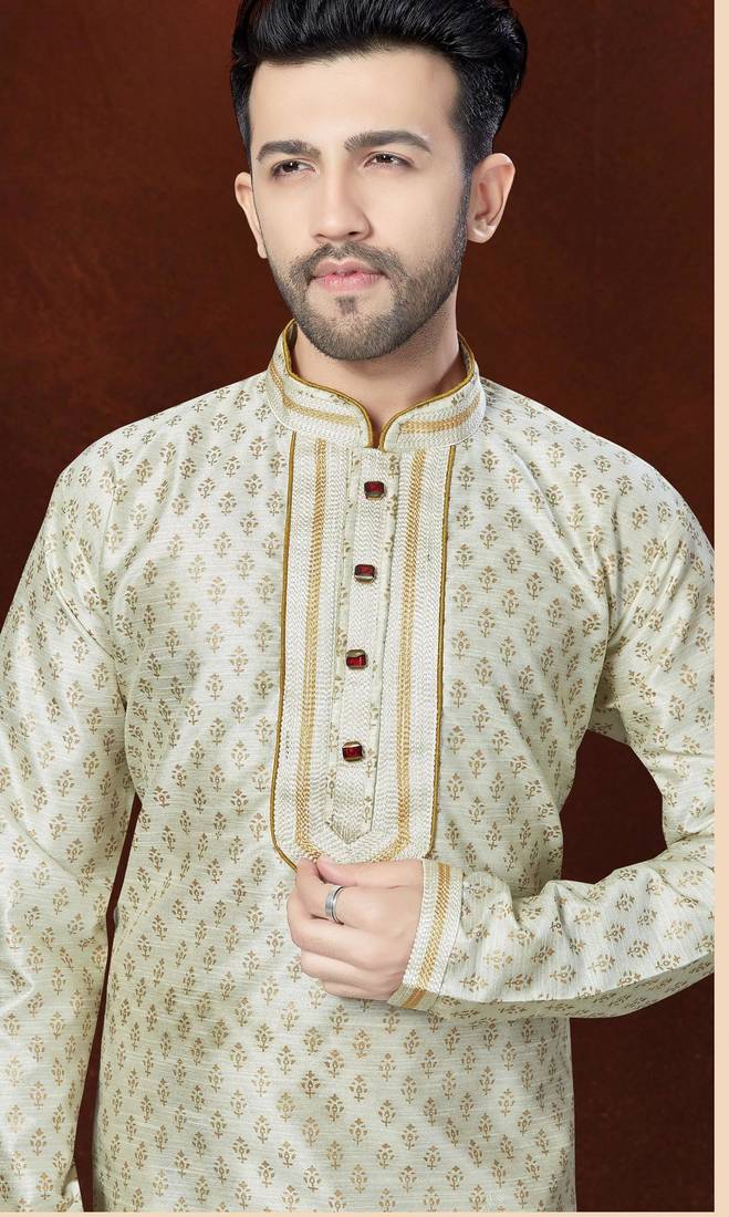 Off white printed kurta with gold-trimmed detailing, paired with gold trousers—an elegant festive look.