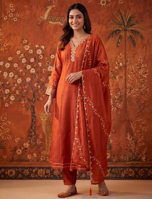 Orange silk blend embroidered churidar set 1