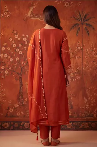 Orange silk blend embroidered churidar set