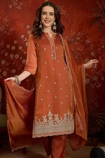 Rust color smart and ethnic silk fabric embroidered partywear suit