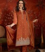 Rust color smart and ethnic silk fabric embroidered partywear suit